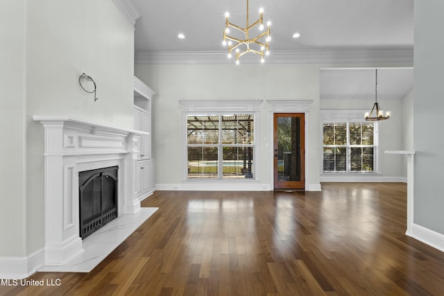 unfurnished living room with a chandelier, crown molding, and dark hardwood / wood-style floors