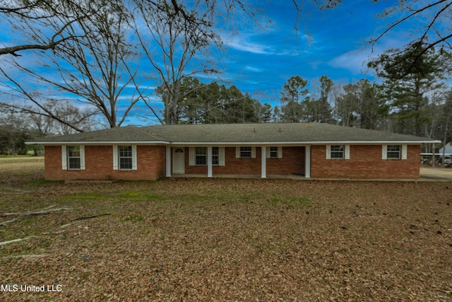 single story home with brick siding and a front lawn