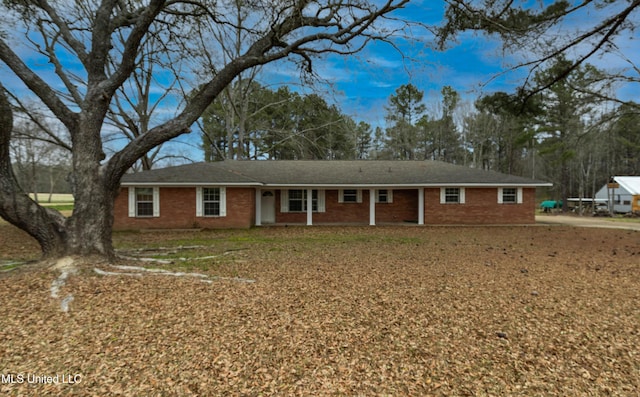 single story home with brick siding