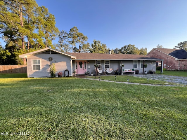 ranch-style home with a front yard