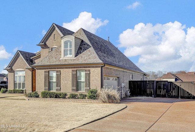 view of side of property featuring a garage