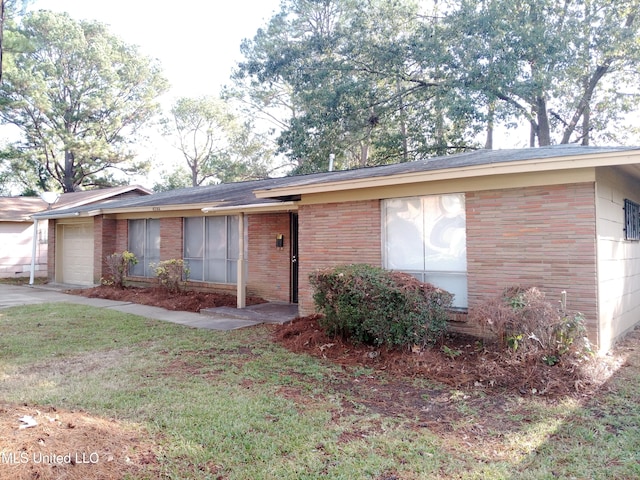 ranch-style house featuring a garage