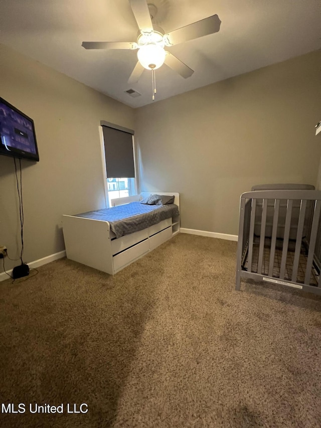 unfurnished bedroom with ceiling fan and carpet flooring