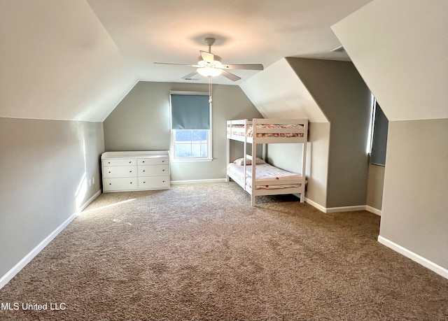 unfurnished bedroom with vaulted ceiling, carpet flooring, and ceiling fan