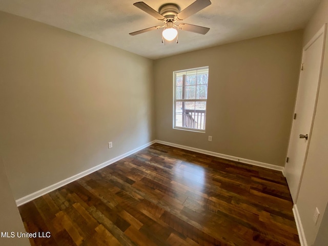 unfurnished bedroom featuring ceiling fan, baseboards, and dark wood finished floors