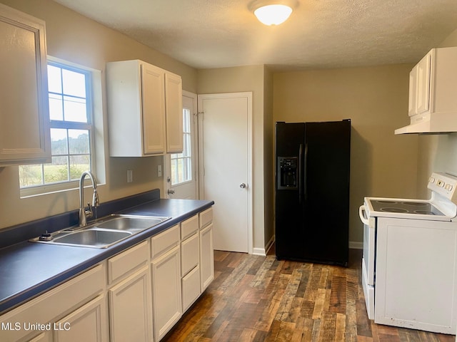 kitchen featuring a sink, black fridge with ice dispenser, white cabinetry, white range with electric stovetop, and dark countertops