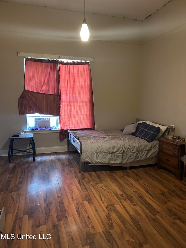 202 Dewey St, Itta Bena, MS 38941 - unfurnished bedroom featuring cooling unit and dark hardwood / wood-style flooring