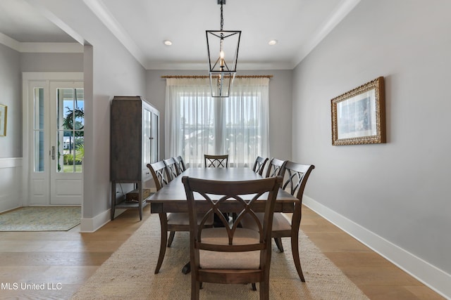 140 Seaside Dr, Ocean Springs, MS 39564 - dining area with light wood-type flooring, ornamental molding, and baseboards