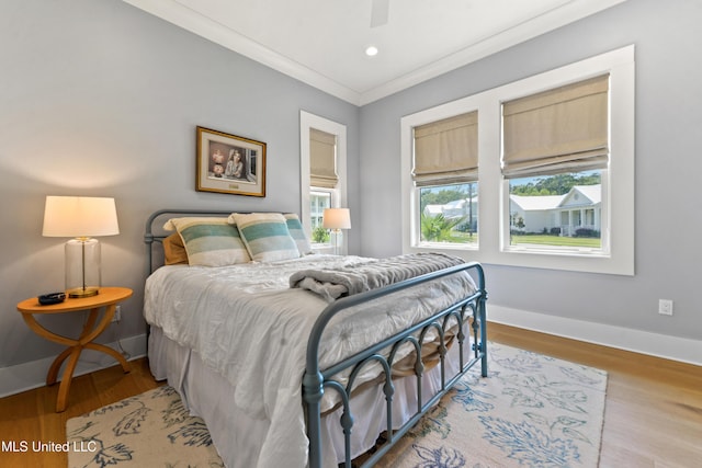 140 Seaside Dr, Ocean Springs, MS 39564 - bedroom with ornamental molding, baseboards, wood finished floors, recessed lighting, and ceiling fan