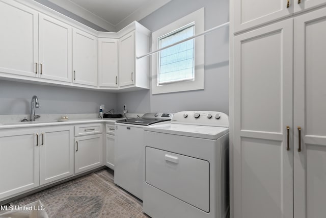 140 Seaside Dr, Ocean Springs, MS 39564 - laundry room featuring cabinet space, washing machine and clothes dryer, and crown molding