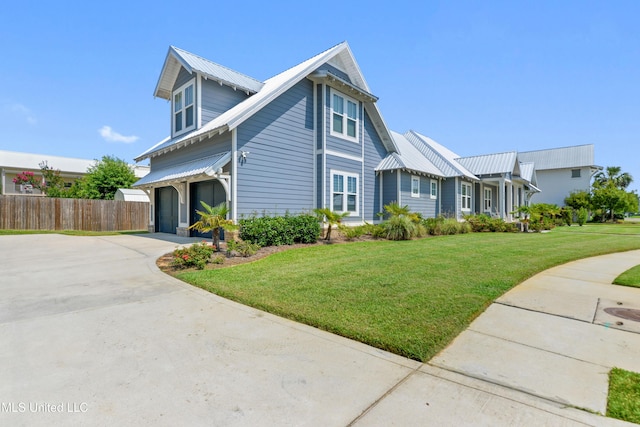 140 Seaside Dr, Ocean Springs, MS 39564 - view of side of home with driveway and metal roof