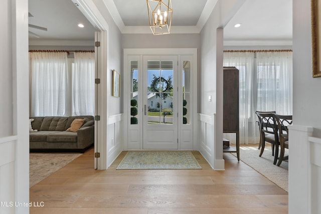 140 Seaside Dr, Ocean Springs, MS 39564 - entryway featuring healthy amount of natural light, a chandelier, wood finished floors, and recessed lighting