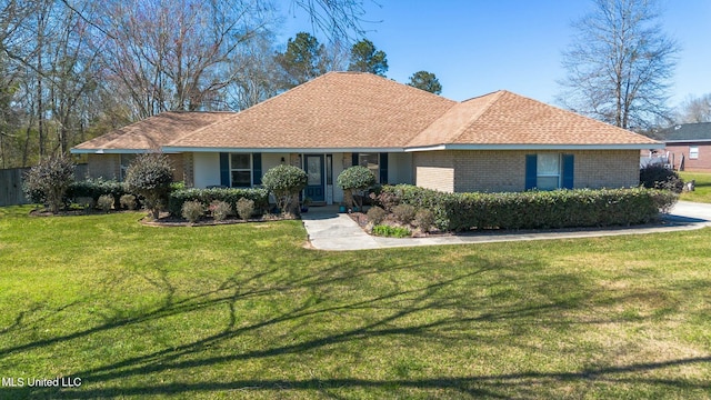 single story home with brick siding, roof with shingles, and a front yard