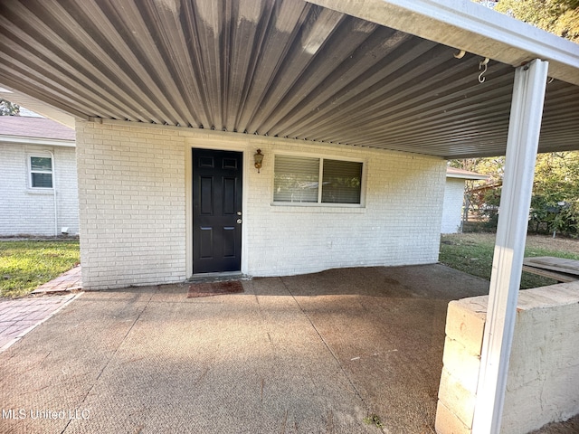 property entrance with a patio