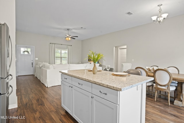 12 Mercer Dr, Petal, MS 39465 - kitchen featuring freestanding refrigerator, dark wood-type flooring, open floor plan, and a ceiling fan