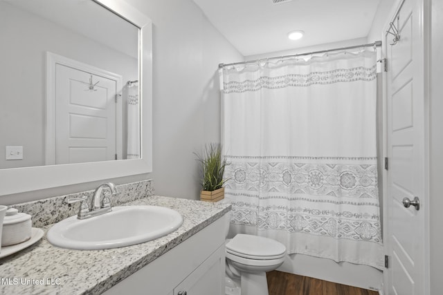12 Mercer Dr, Petal, MS 39465 - full bathroom with vanity, toilet, wood finished floors, and shower / bathtub combination with curtain