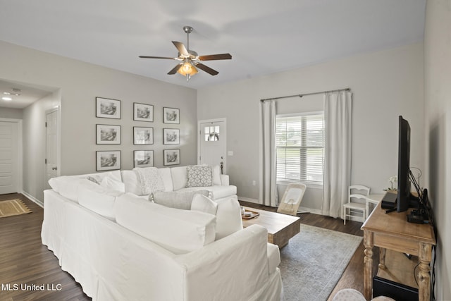 12 Mercer Dr, Petal, MS 39465 - living room featuring a ceiling fan, dark wood-type flooring, and baseboards
