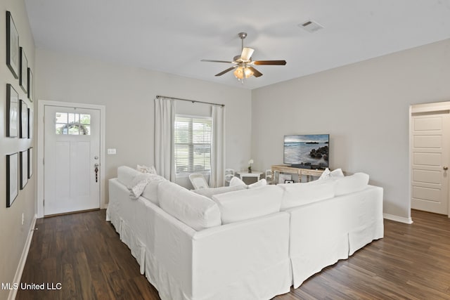 12 Mercer Dr, Petal, MS 39465 - living area featuring dark wood-style flooring, ceiling fan, and baseboards