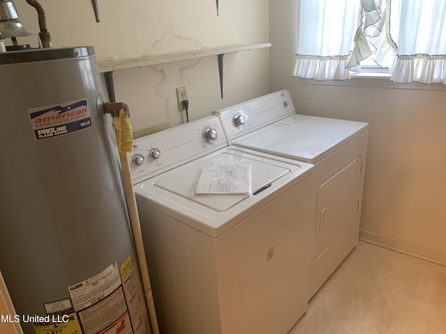 laundry area with gas water heater, laundry area, and washing machine and clothes dryer