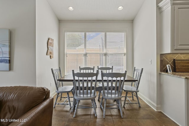 dining space with baseboards and recessed lighting