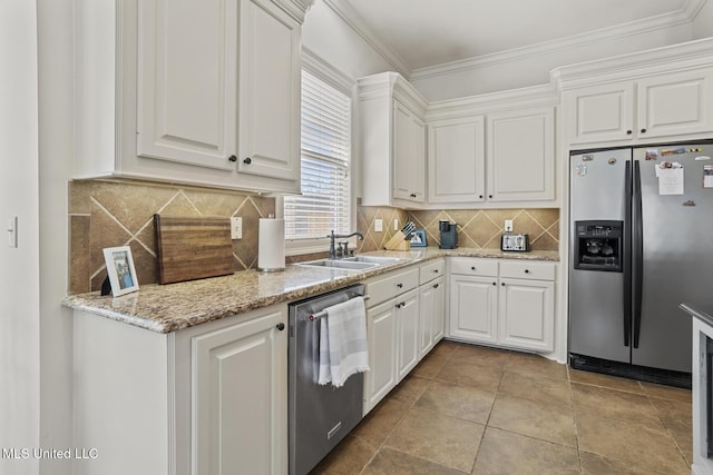 kitchen featuring stainless steel appliances, white cabinets, a sink, and crown molding