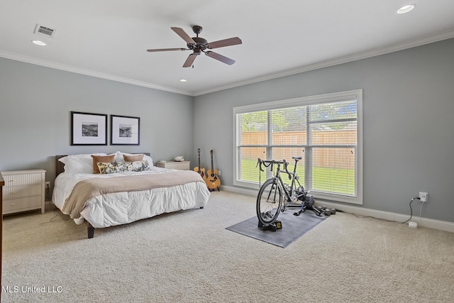 bedroom featuring carpet flooring, crown molding, recessed lighting, baseboards, and ceiling fan