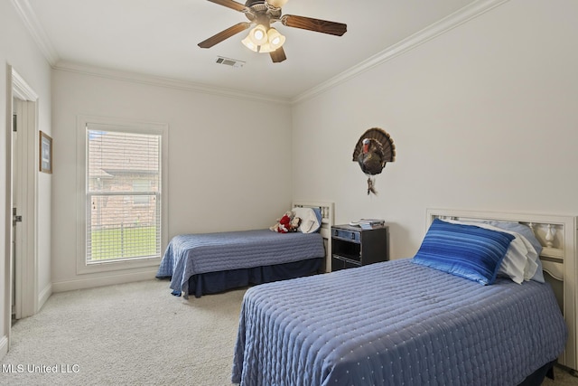 bedroom featuring crown molding, carpet flooring, baseboards, and ceiling fan