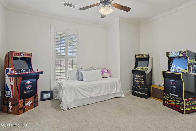 carpeted bedroom featuring ornamental molding and ceiling fan