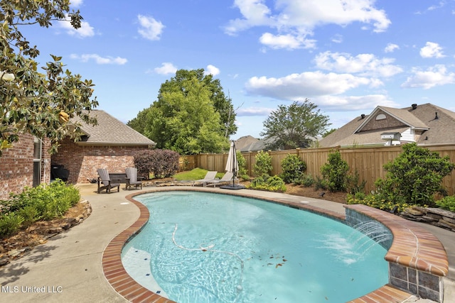 view of swimming pool with a fenced backyard and a patio area