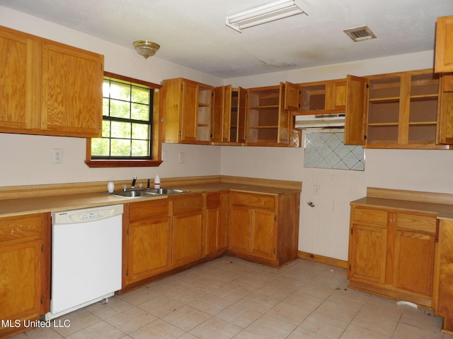 157 Tubman Cir, Natchez, MS 39120 - kitchen with white dishwasher, open shelves, brown cabinetry, under cabinet range hood, and light tile patterned floors
