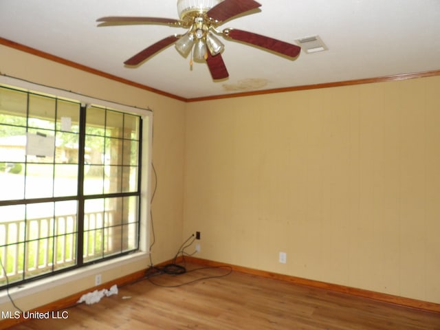 157 Tubman Cir, Natchez, MS 39120 - unfurnished room featuring plenty of natural light, wood finished floors, a ceiling fan, and crown molding