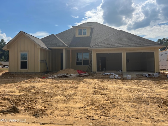 back of house with a garage