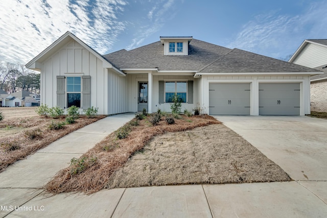 628 Cobalt Way, Brandon, MS 39042 - view of front of property with an attached garage, roof with shingles, board and batten siding, and concrete driveway