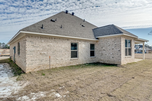 view of property exterior with a yard