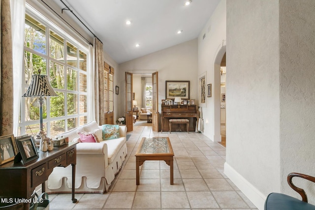 living area featuring vaulted ceiling