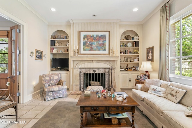 tiled living room featuring ornamental molding and built in features