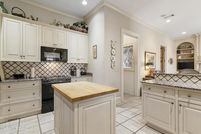 kitchen featuring black appliances, a center island, wood counters, backsplash, and ornamental molding