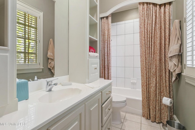 full bathroom with toilet, vanity, tile patterned flooring, and shower / tub combo with curtain