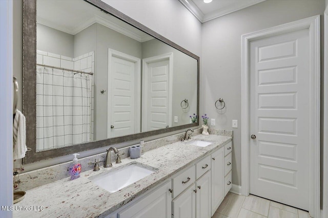bathroom with double vanity, a sink, a shower with curtain, and ornamental molding