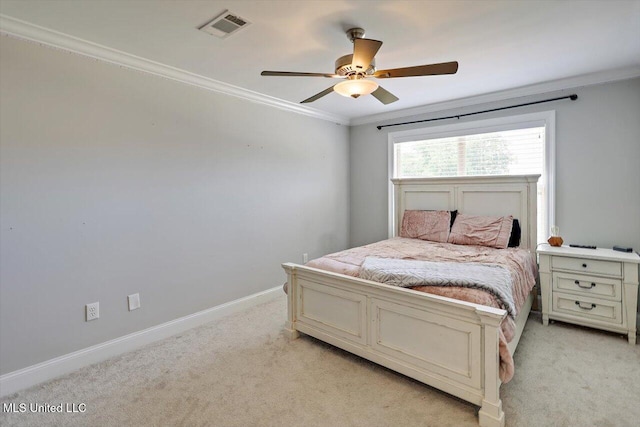 bedroom featuring crown molding, light colored carpet, baseboards, and visible vents