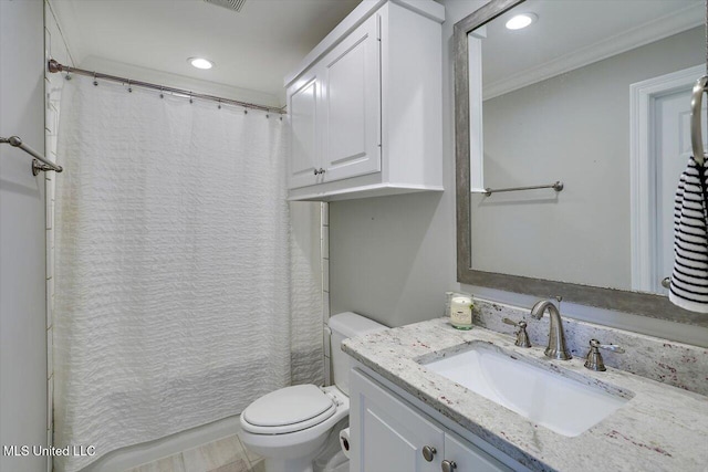 bathroom with recessed lighting, crown molding, toilet, and vanity