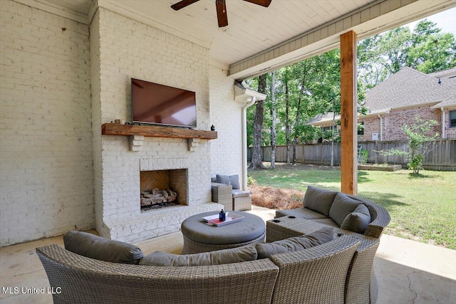 view of patio featuring a fenced backyard, a ceiling fan, and an outdoor living space with a fireplace