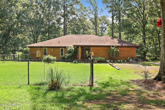 ranch-style home featuring a front yard