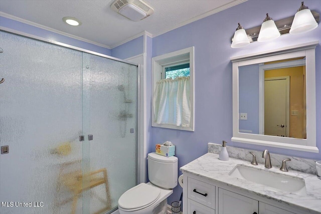 bathroom featuring vanity, a shower with shower door, ornamental molding, and toilet