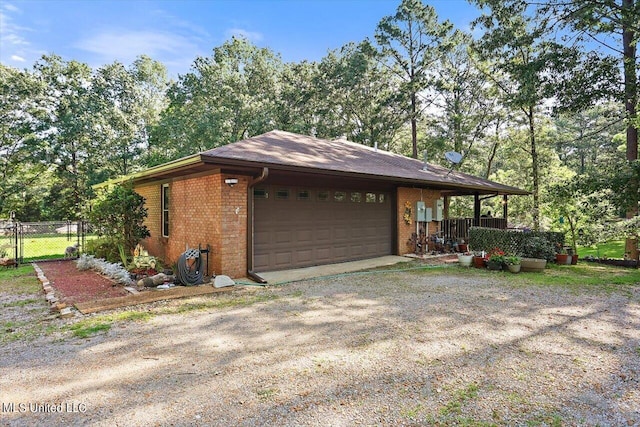 view of side of home with a garage