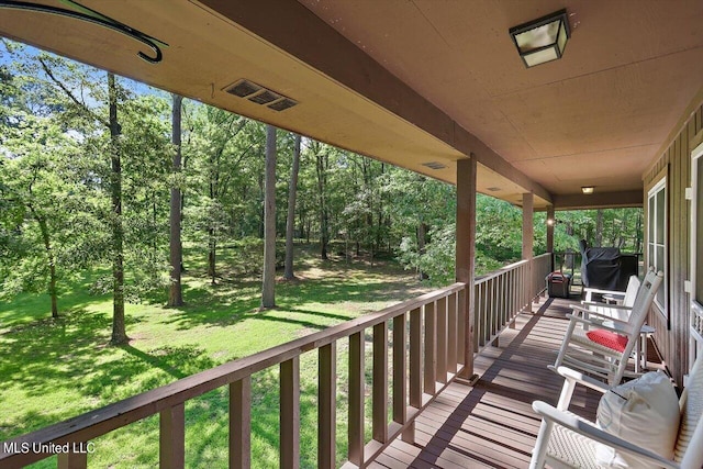 deck featuring a lawn