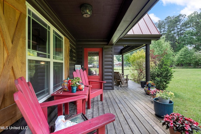 wooden deck with a yard