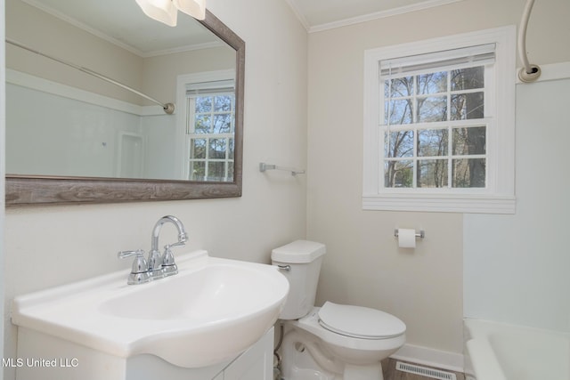 full bath featuring toilet, vanity, visible vents, and crown molding