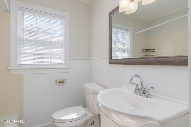 bathroom featuring toilet and vanity