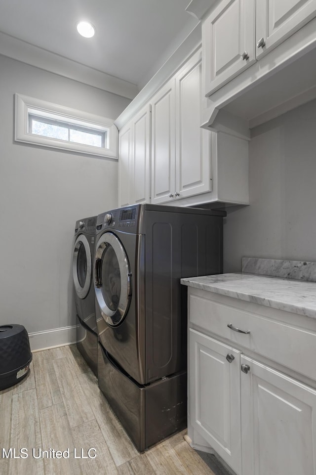 123 Klaas Blvd, Madison, MS 39110 - laundry room with cabinet space, washer and clothes dryer, light wood-style flooring, and recessed lighting